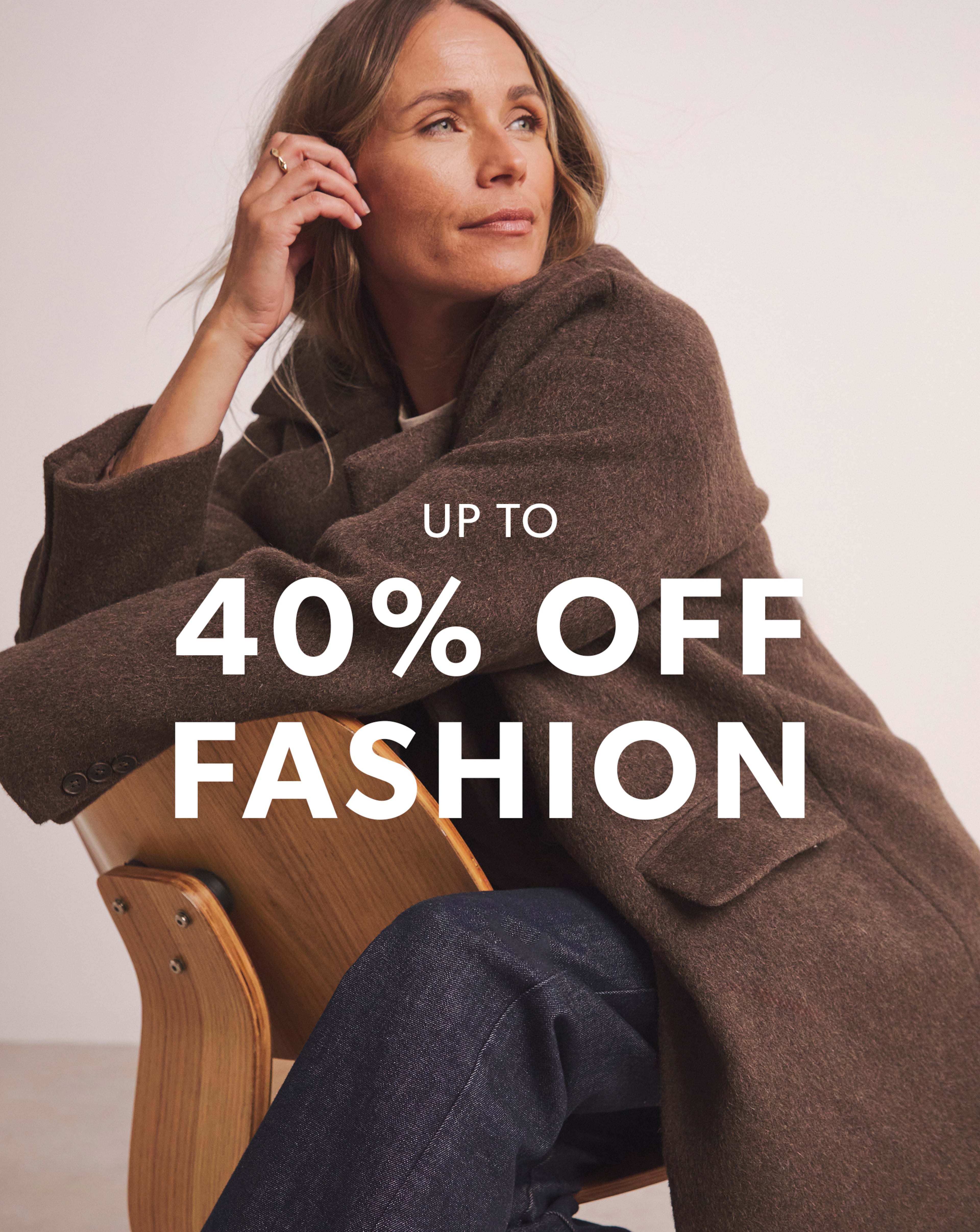 Woman wearing coat from JD Williams 