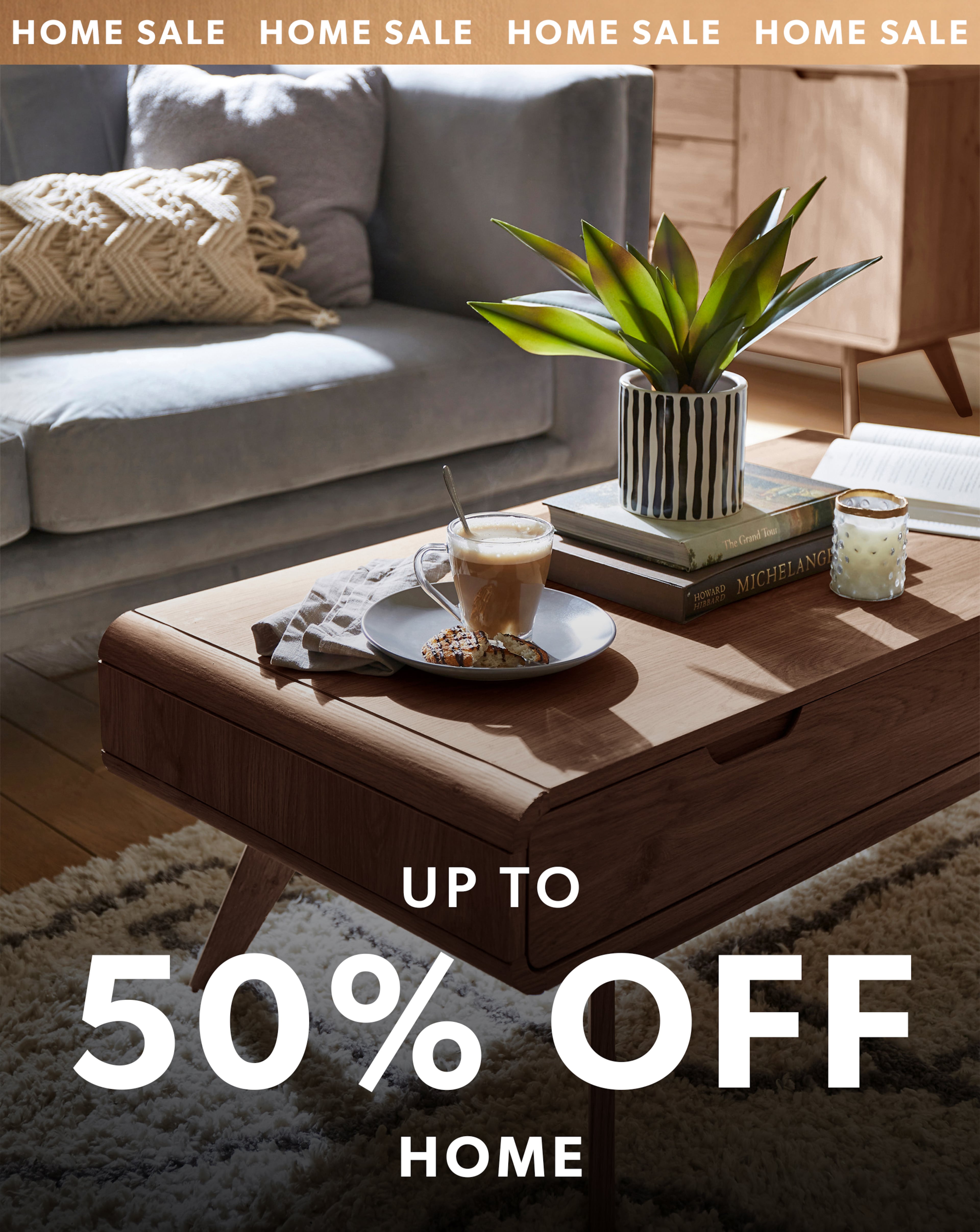 A modern living room with a wooden coffee table and a grey sofa. 
