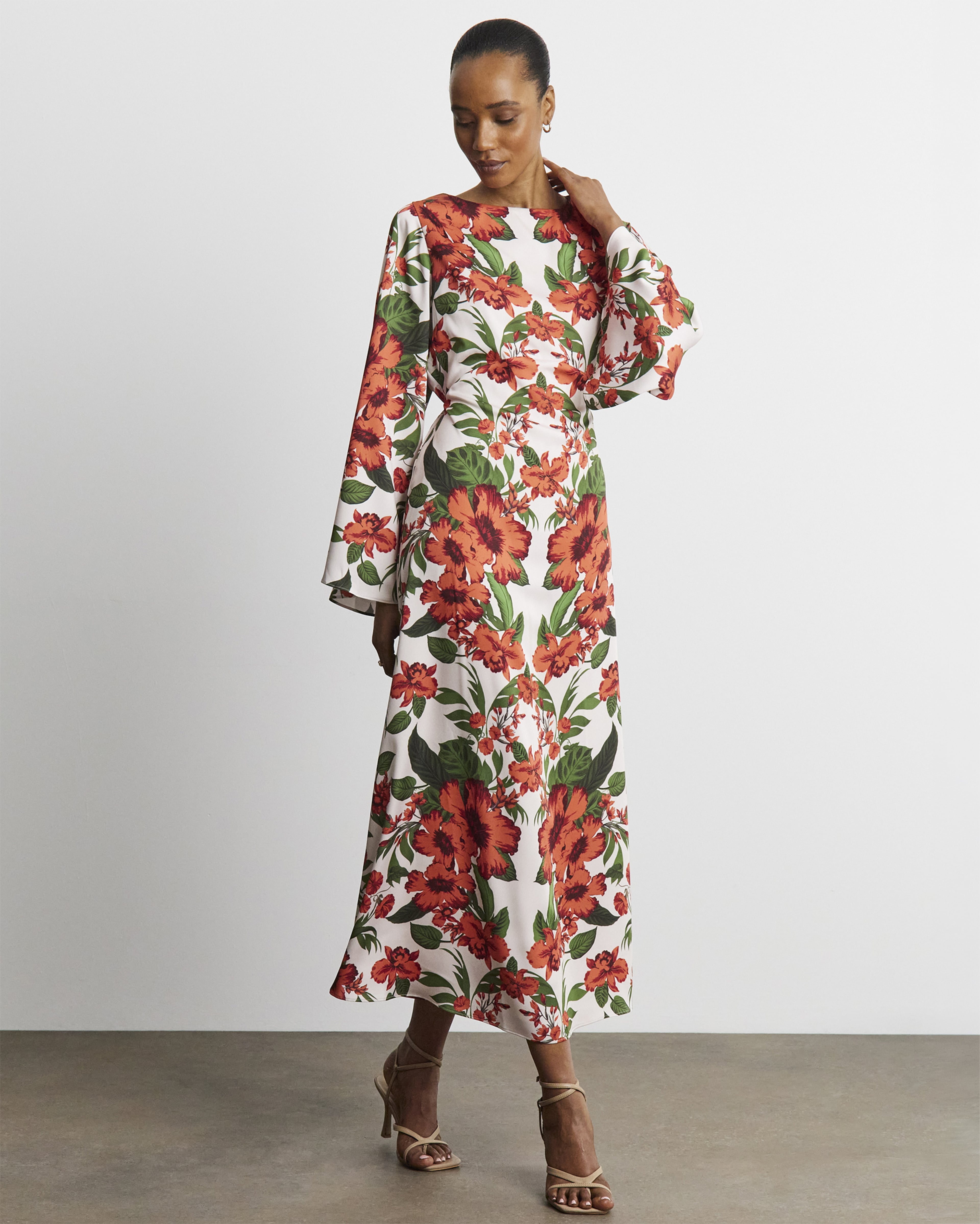 Woman wearing flowered patteren Ambrose Wilson dress