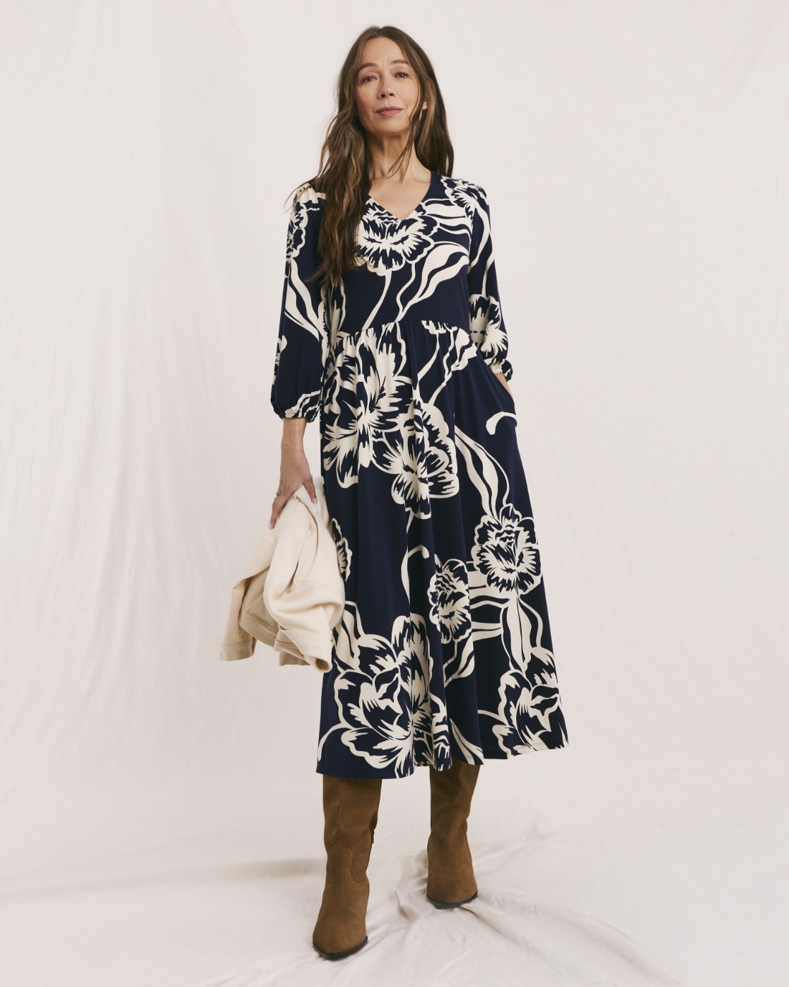 Woman wearing a navy blue and white print dress