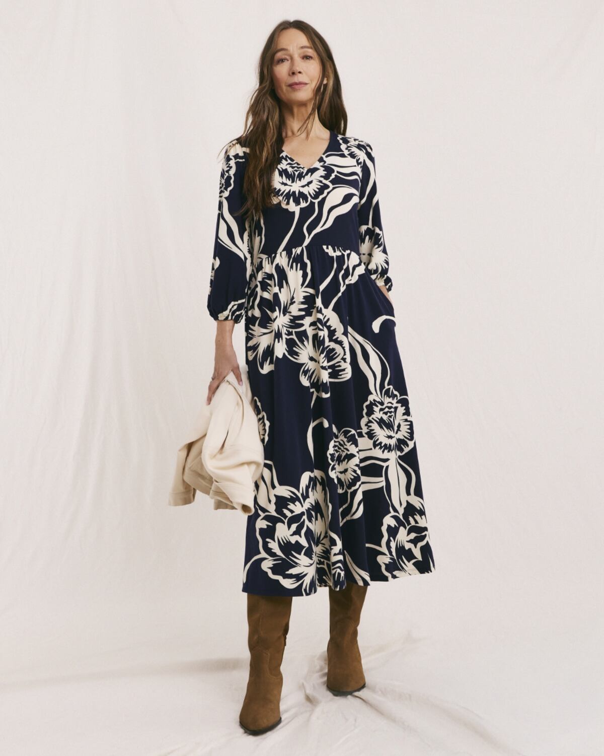 Woman wearing a navy blue and white print dress