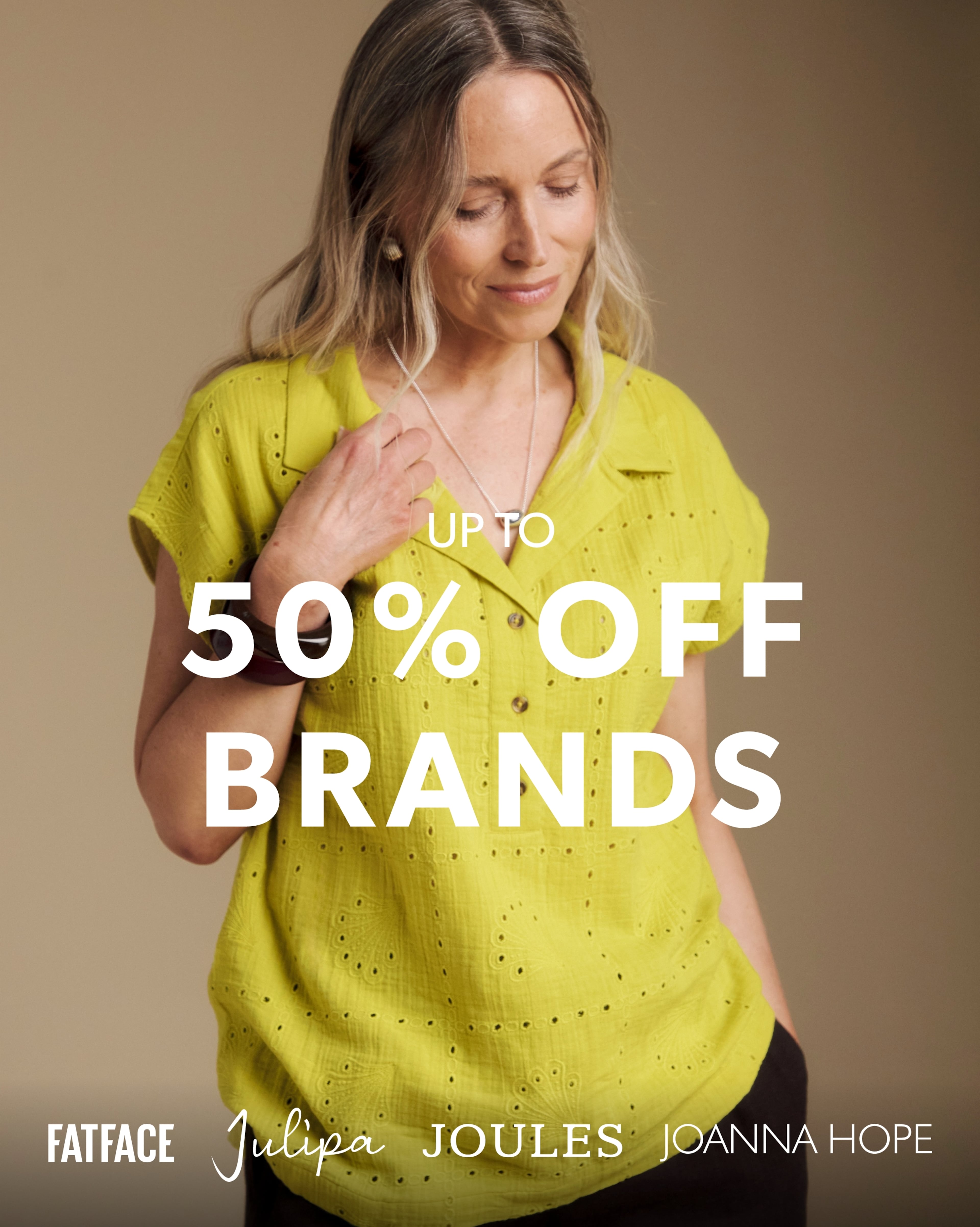 Person wearing a chartreuse-coloured Julipa Broderie Pop Over Top against a neutral background. Overlay text reads: “Up to 50% off Brands,” with FatFace, Julipa, Joules and Joanna Hope logos at the bottom.
