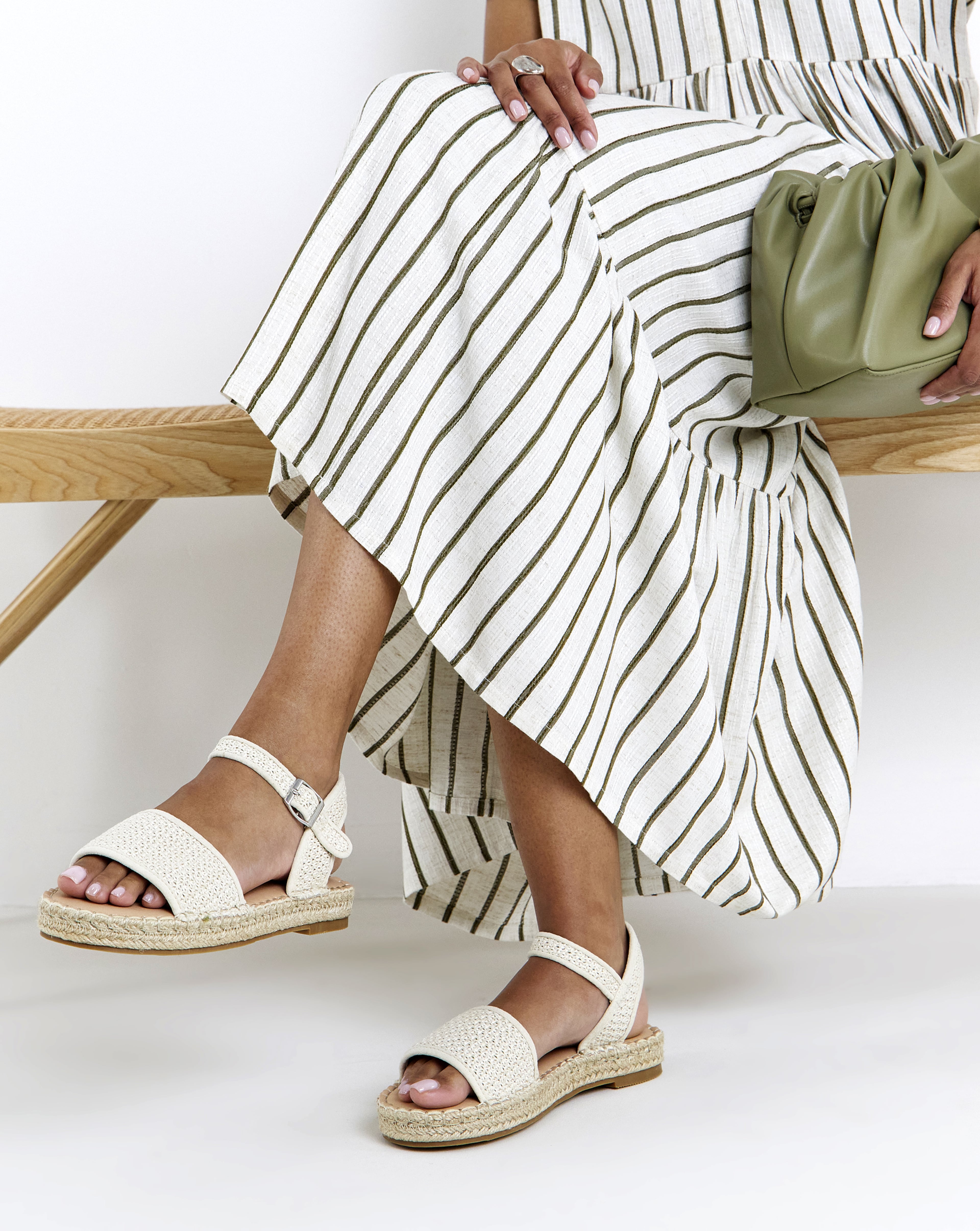 Woman sat down wearing Ambrose Wilson shoes