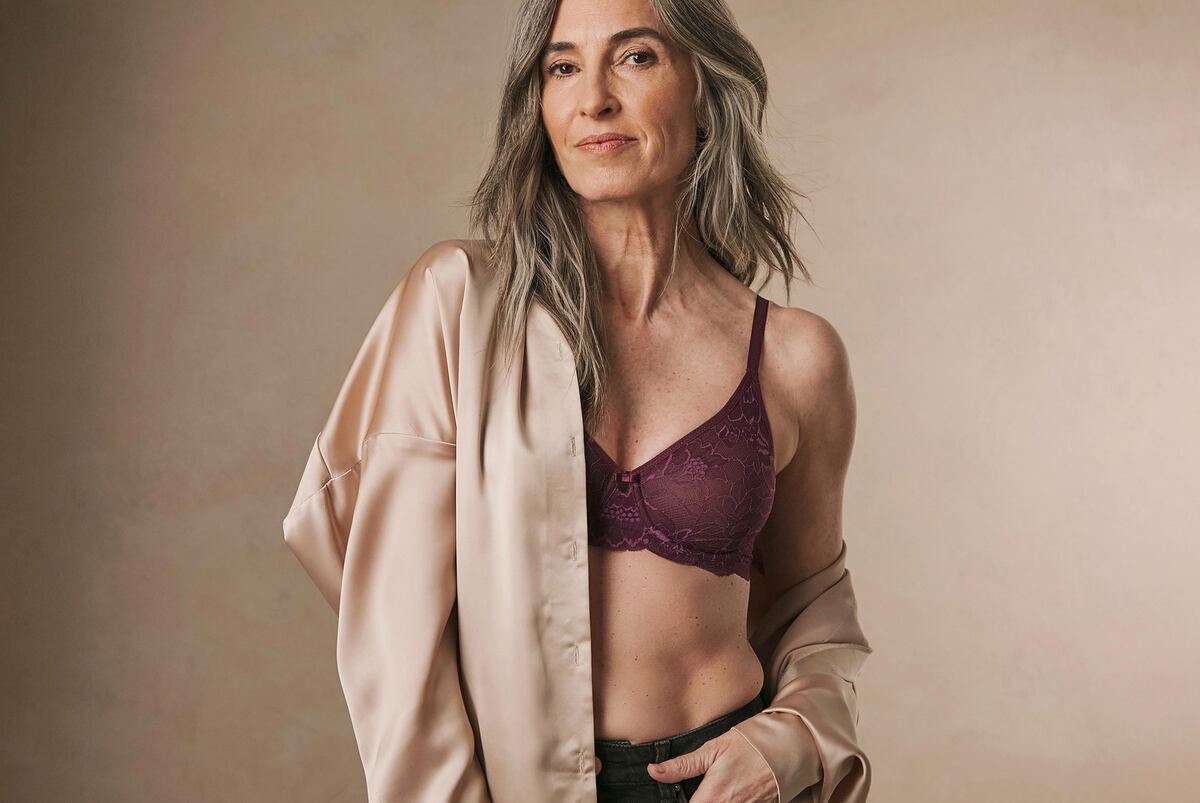 A woman wearing burgundy lingerie