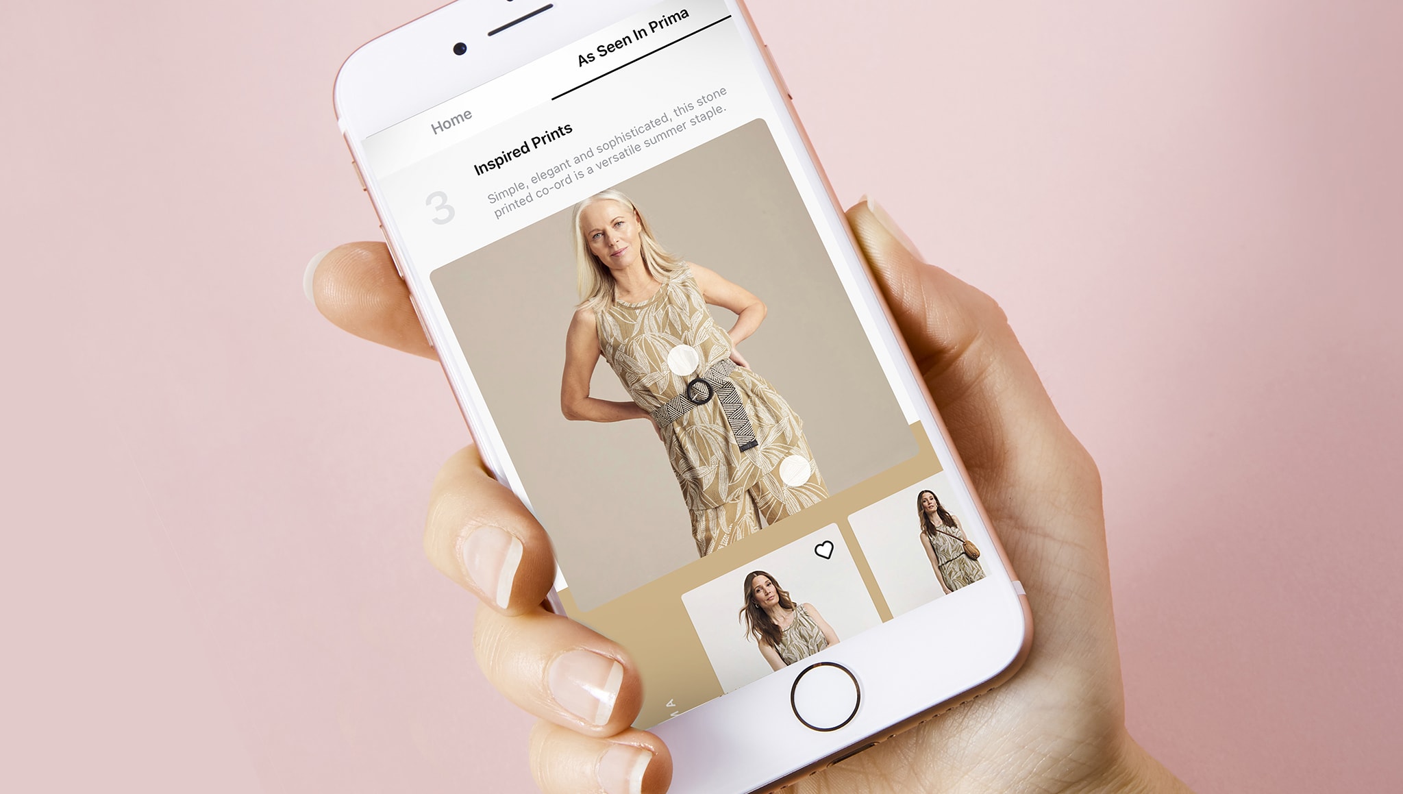 A photo of a mobile phone with an Ambrose Wilson dress image