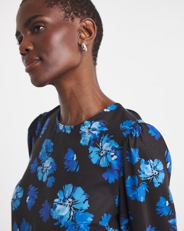 Printed Long Sleeve Peplum Top