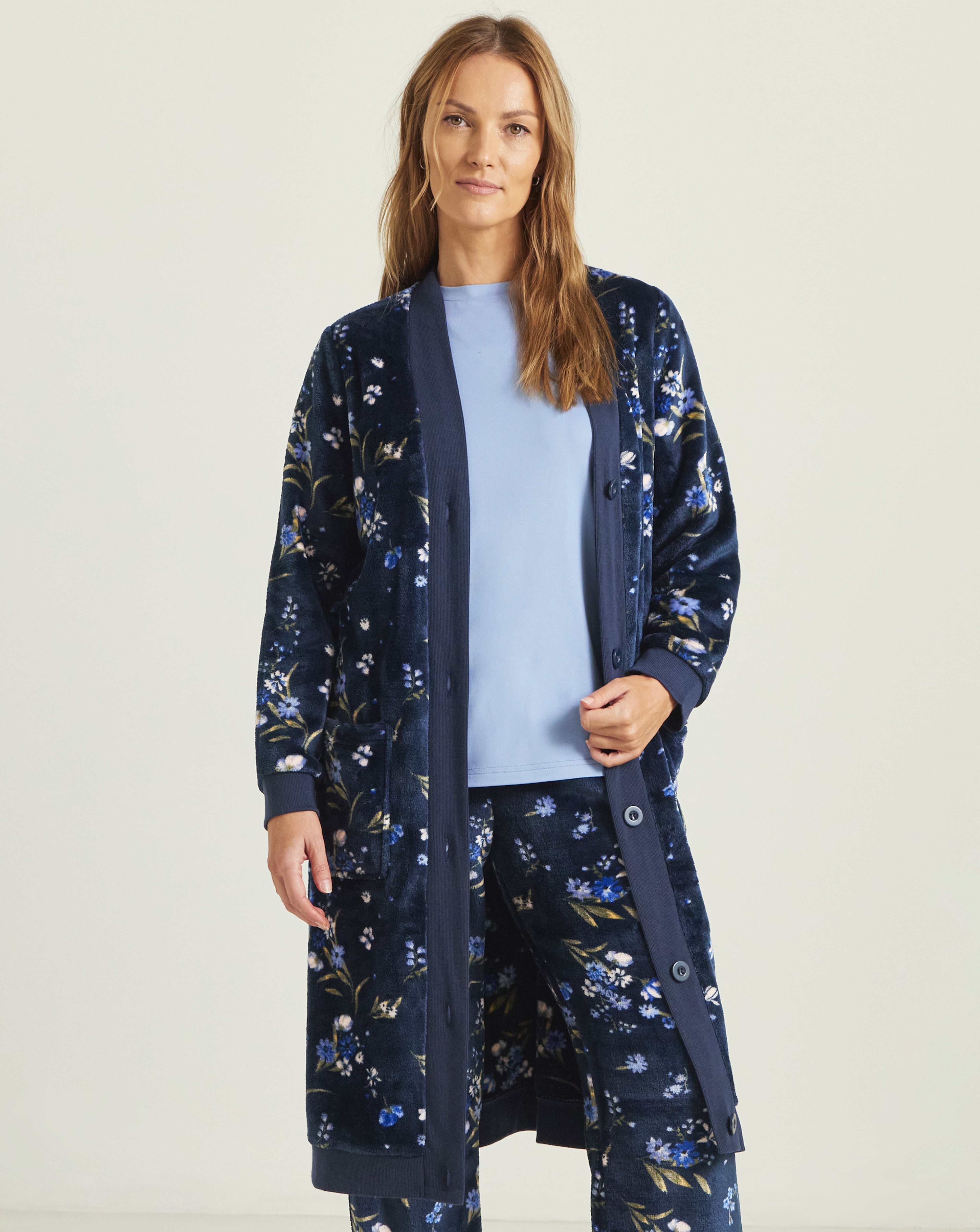 Model wearing a Julipa floral print fleece lounge set.