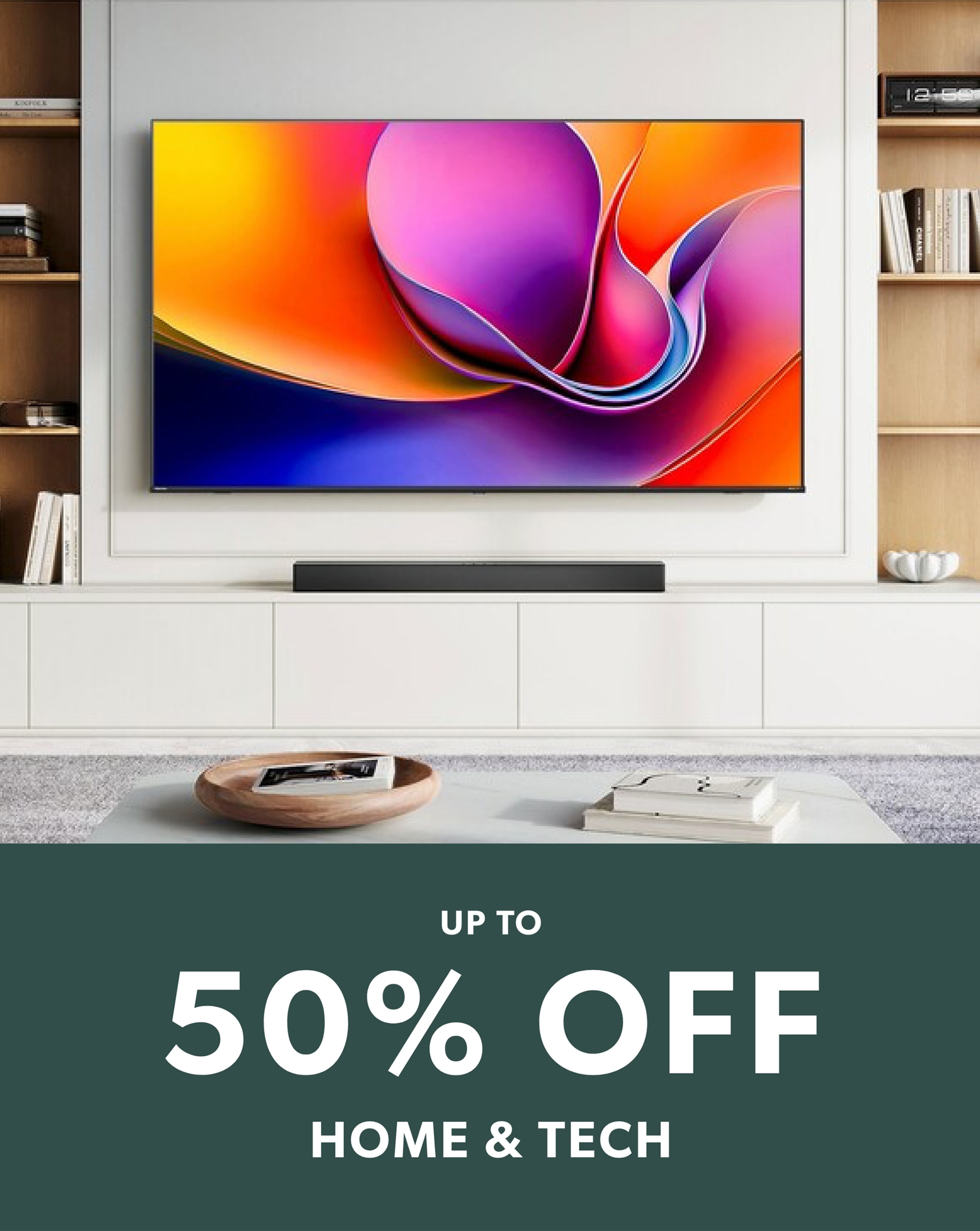 A large TV mounted on the wall, above a sound bar.