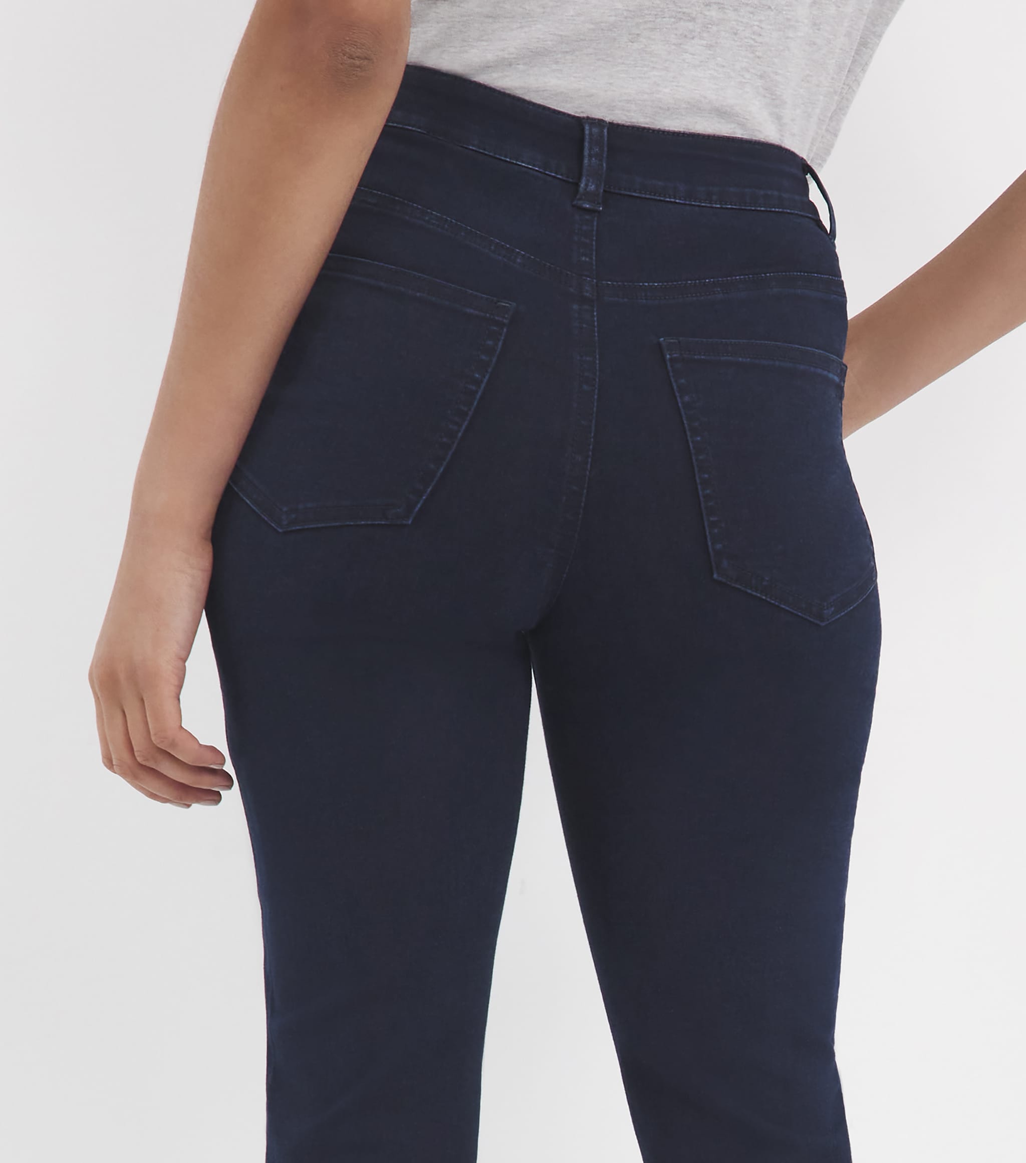 Rear pocket detail of slim fit jeans