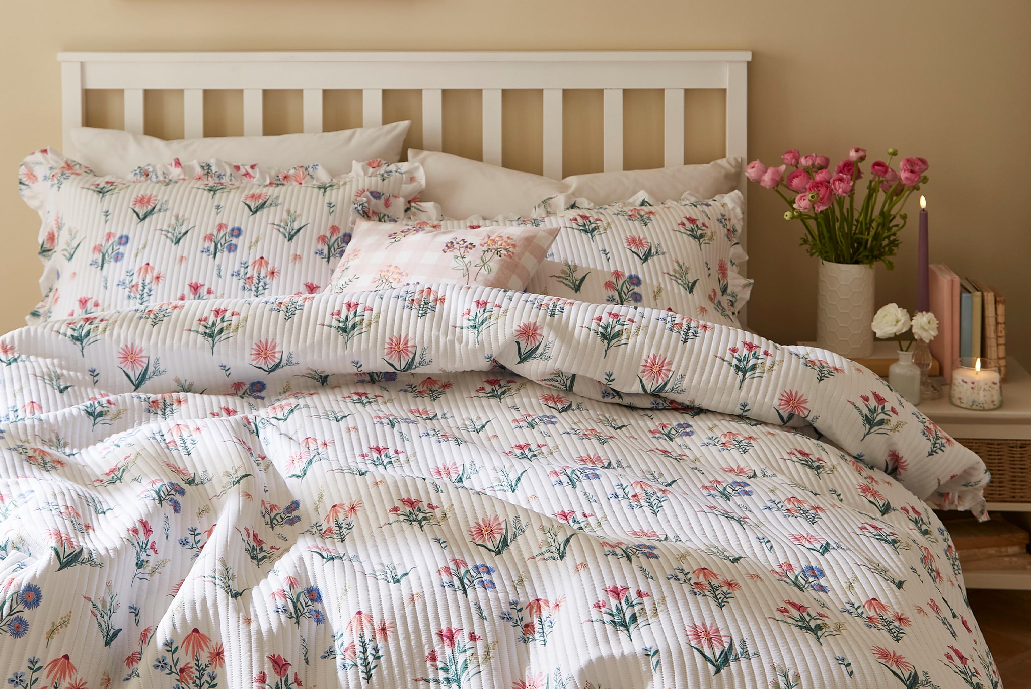 Bedroom with a flowered duvet set