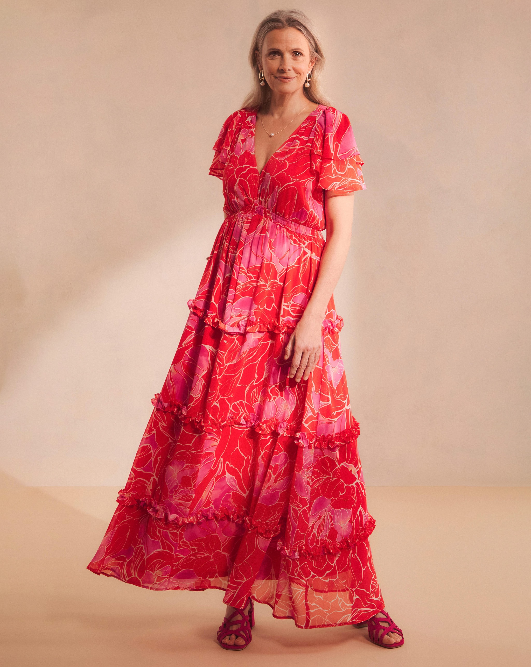 Model wearing a red Joanna Hope maxi dress