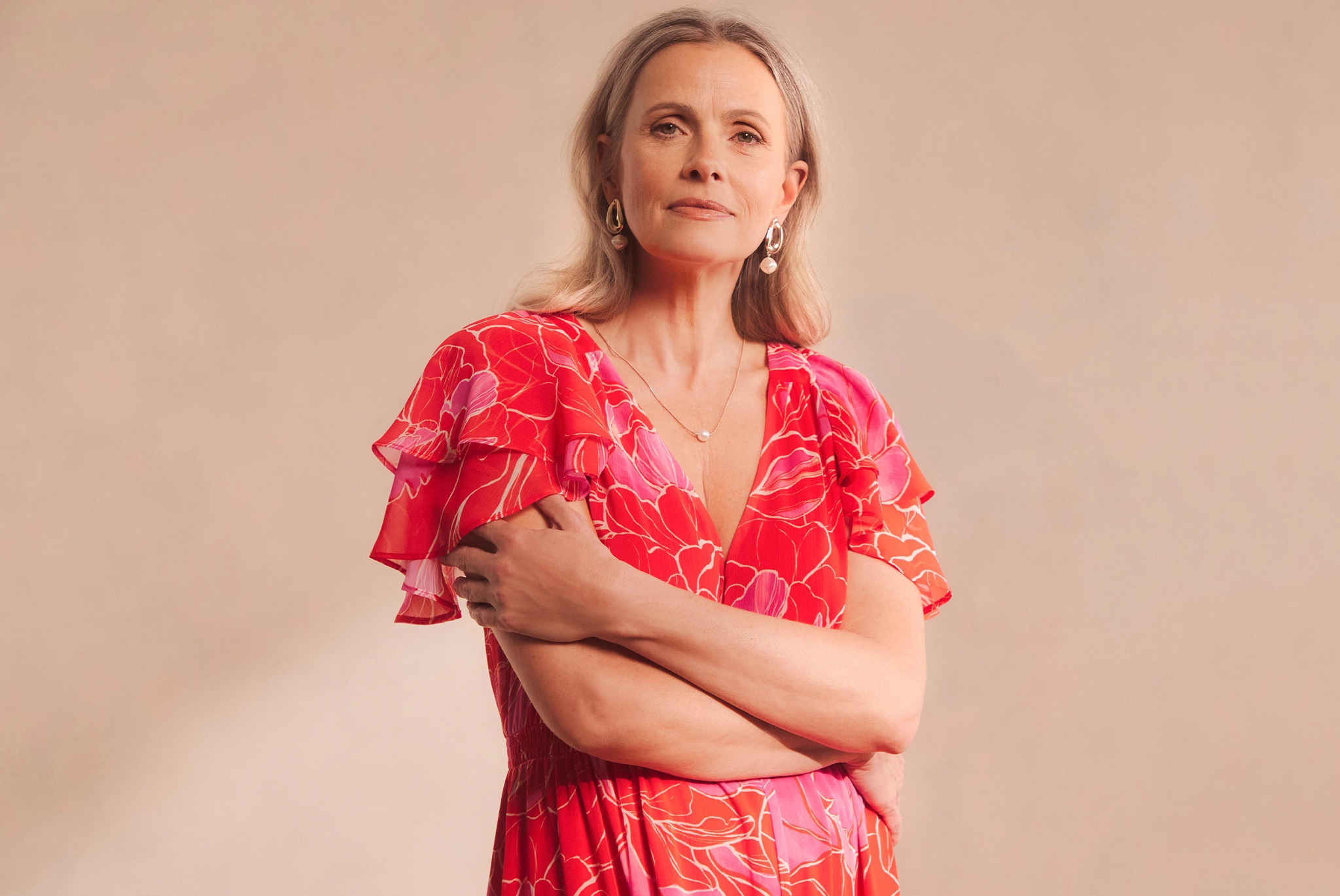 Woman in coral coloured dress