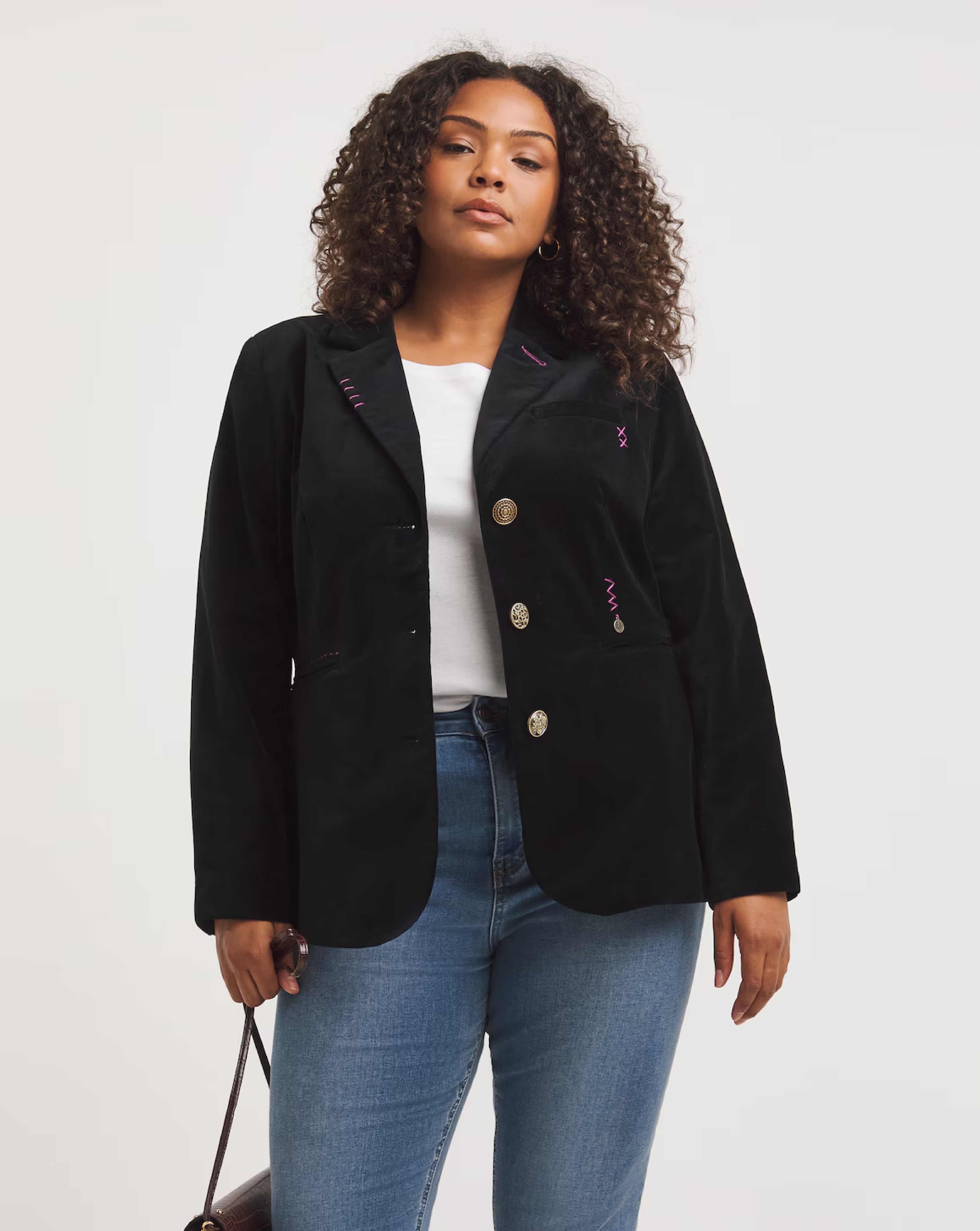 A woman wearing a black blazer