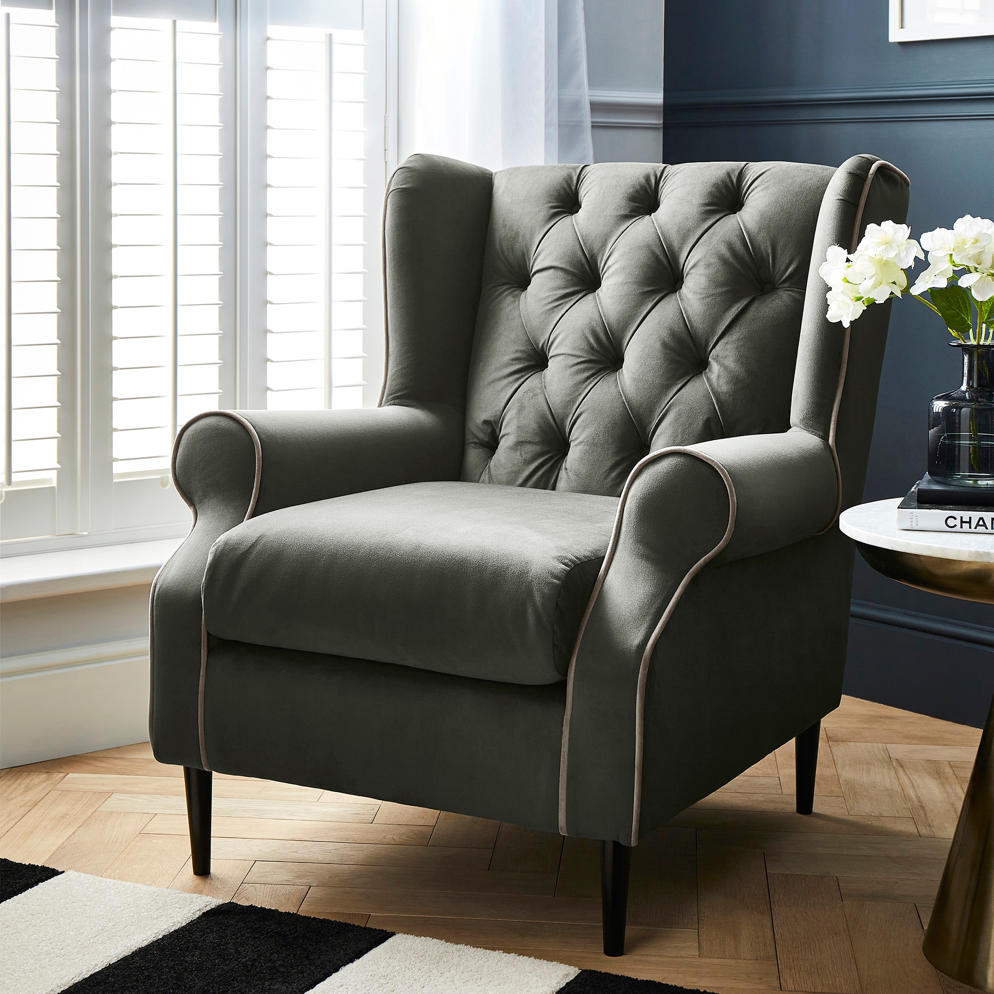 An olive green high back armchair
