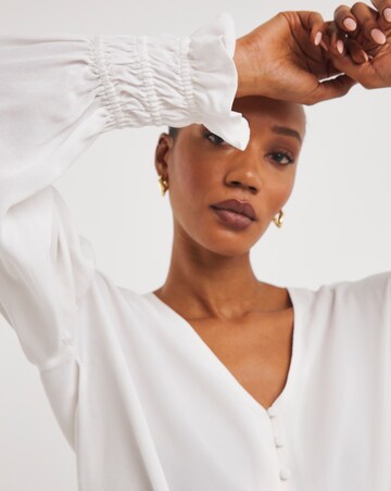 Ivory Button Through Dipped Back Blouse