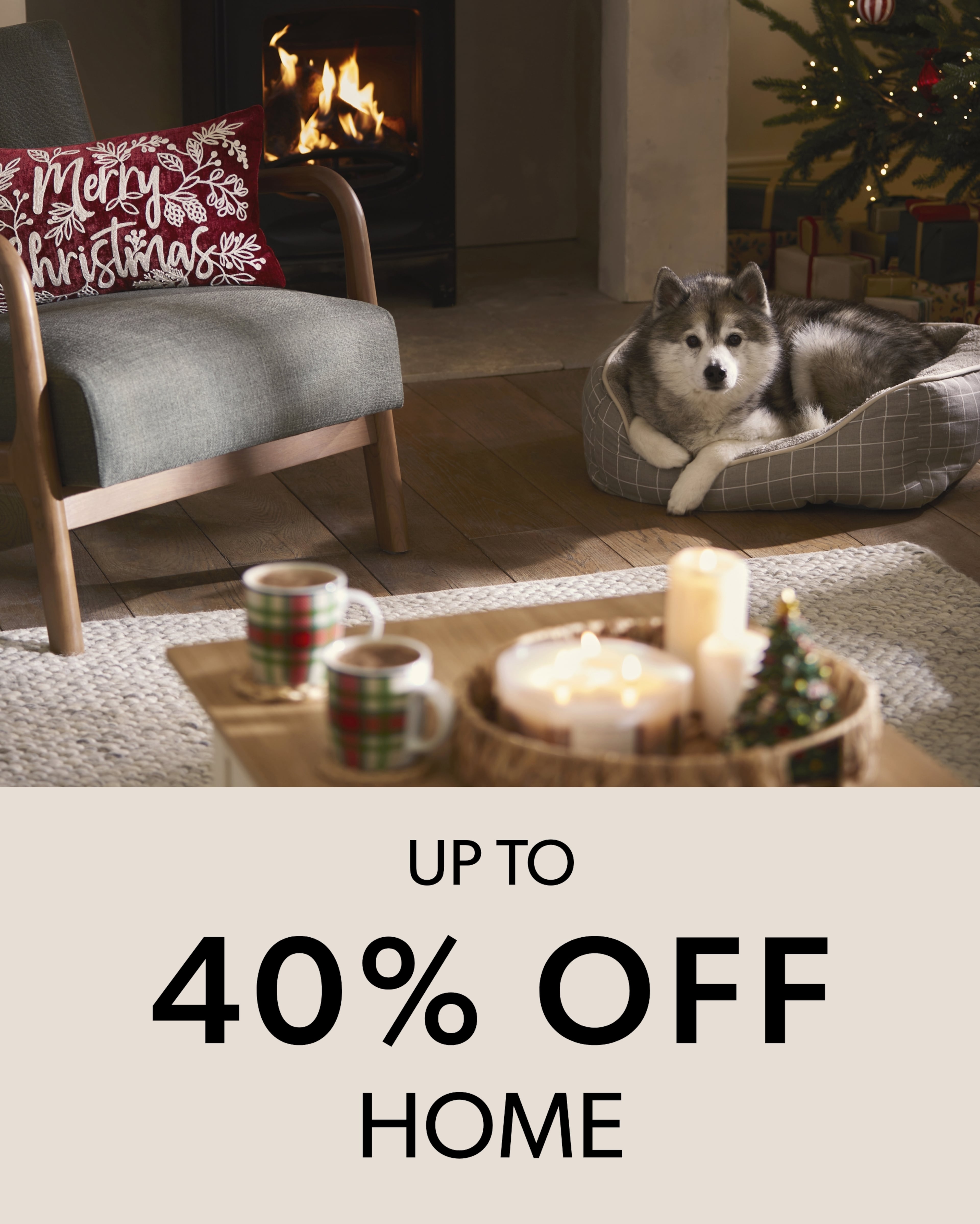 A warm holiday scene featuring a fluffy husky resting in a plaid dog bed by a lit fireplace, holiday decor, Christmas tree, and mugs on a coffee table, conveying family, comfort, and festive cheer.