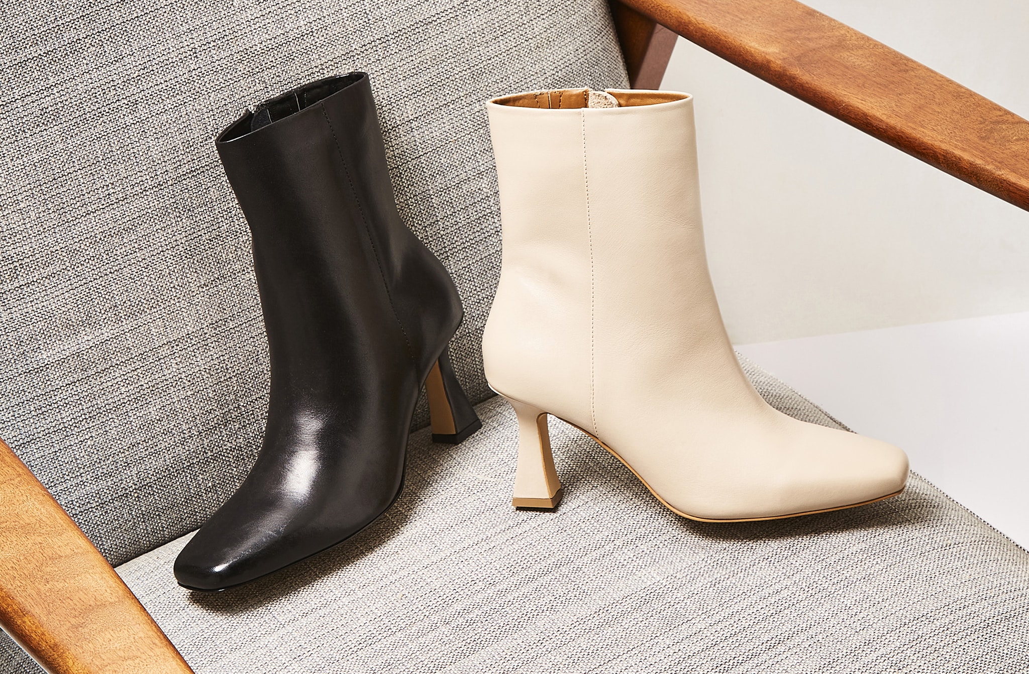 2 ankle length boots in black and cream with heels
