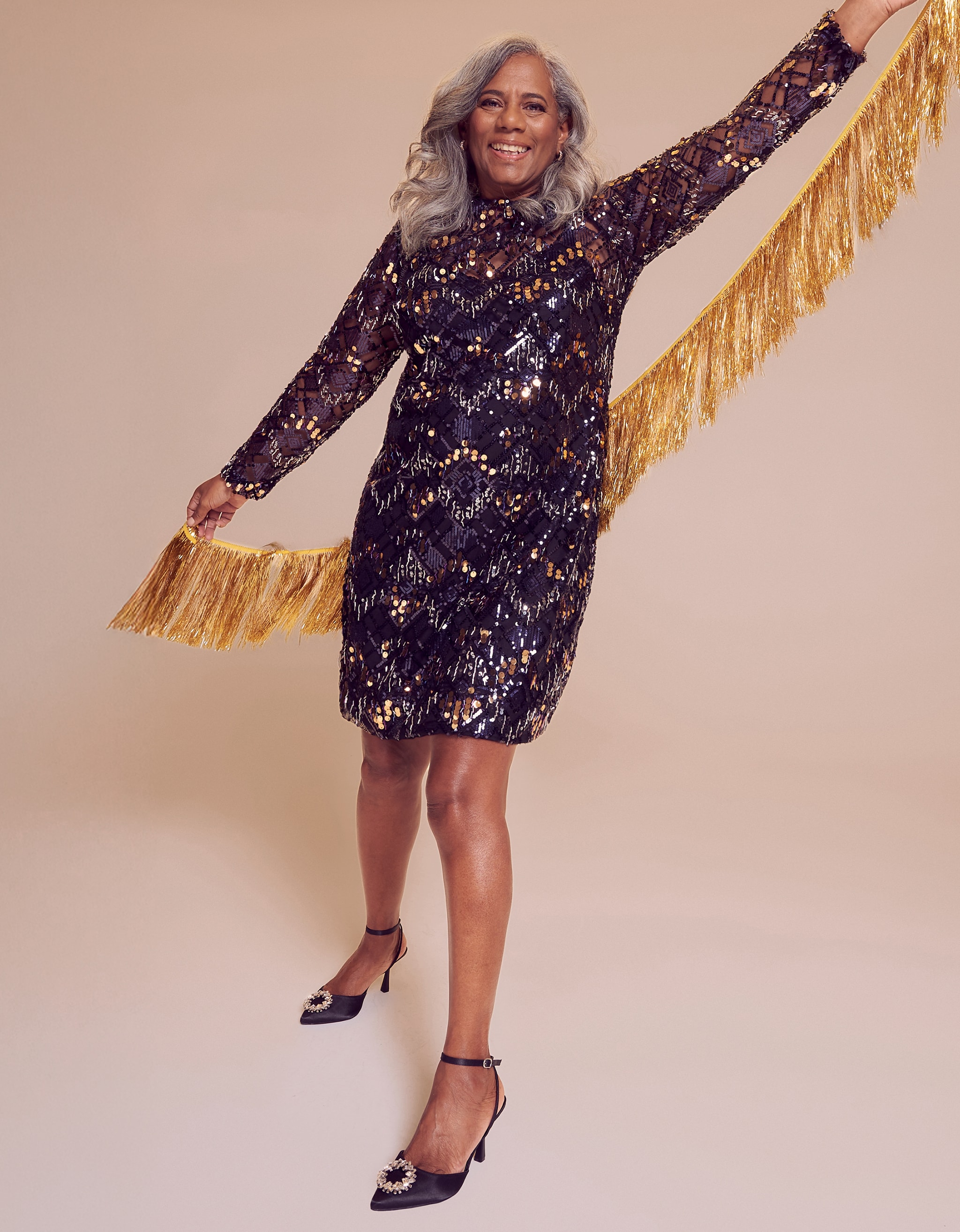 A women wearing a Christmas sparkly dress