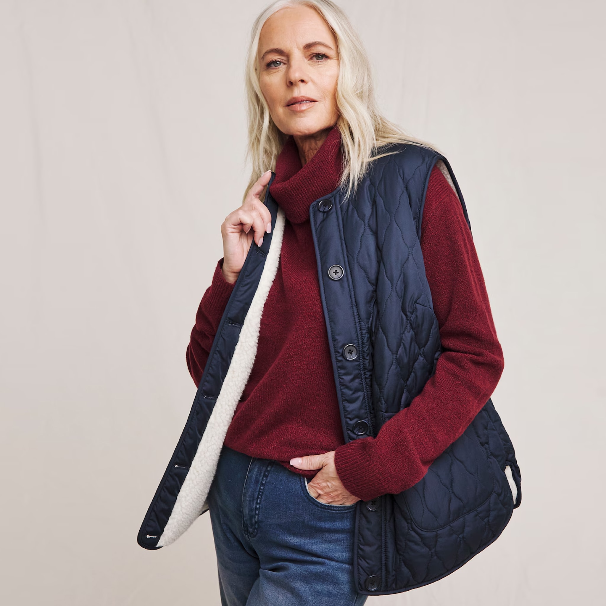 A woman wearing a navy blue quilted gilet