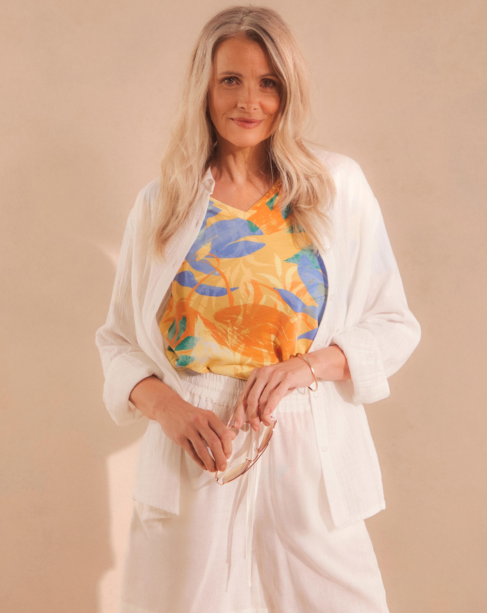 Model wearing a white jacket and a Julipa V Neck Printed T-Shirt