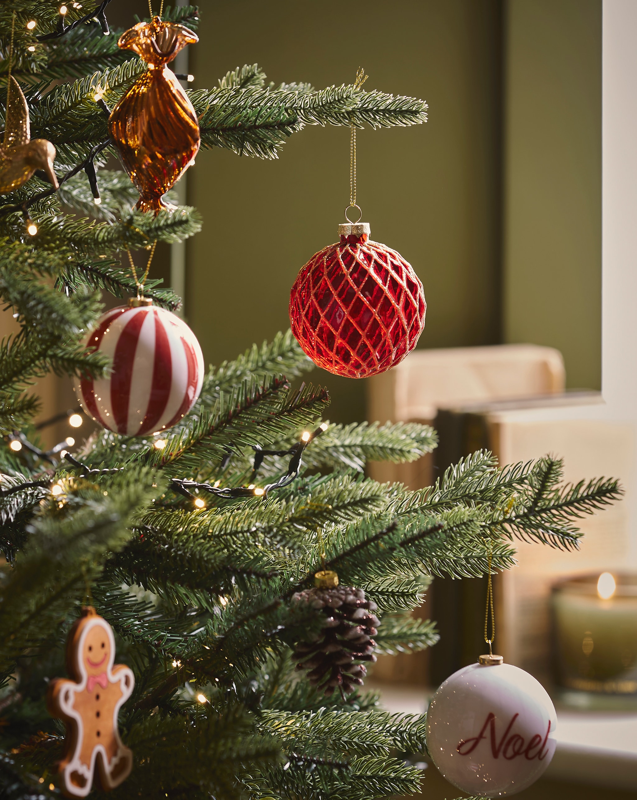 A close-up of decorations on a Christmas tree.