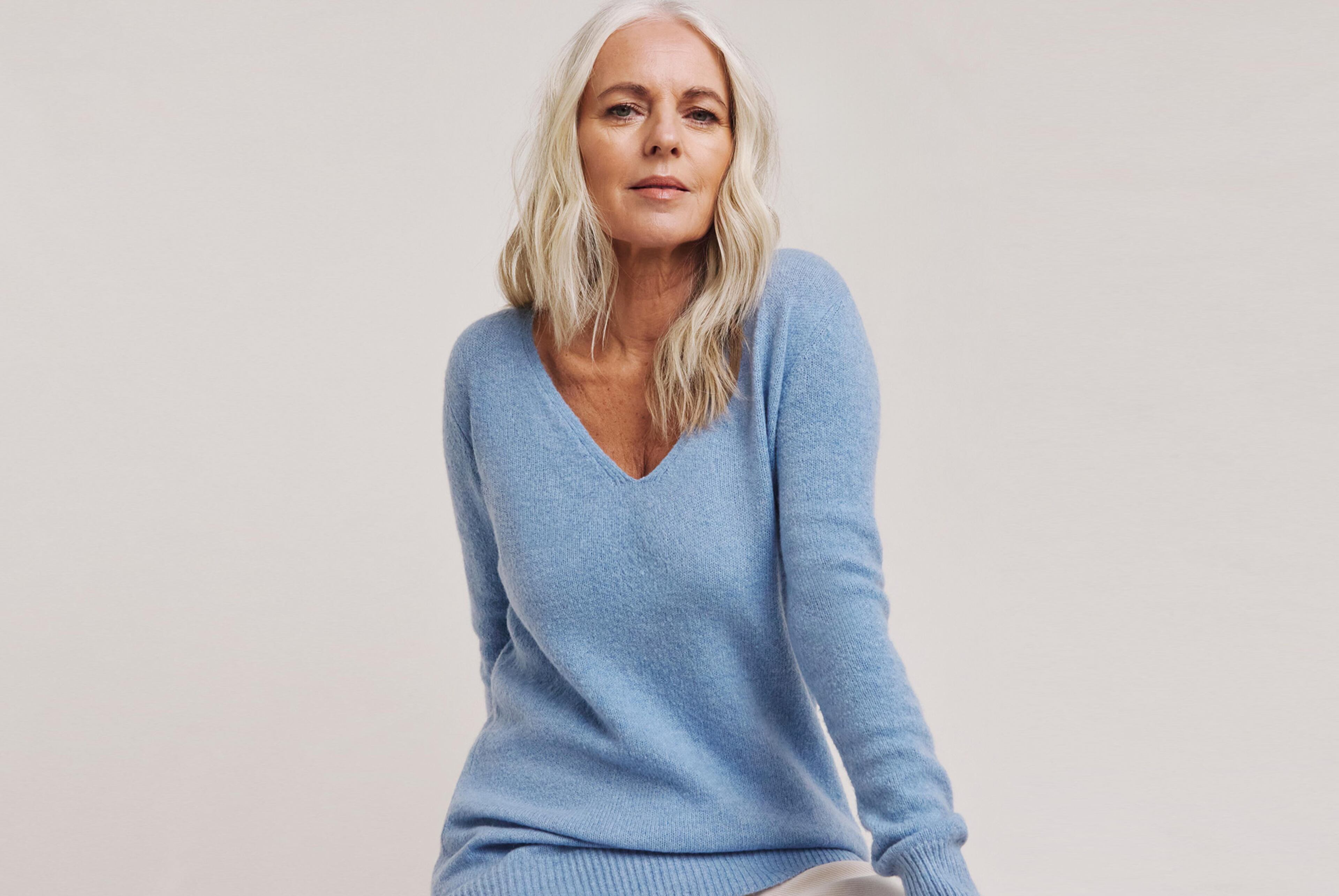 Model wearing a blue wool jumper