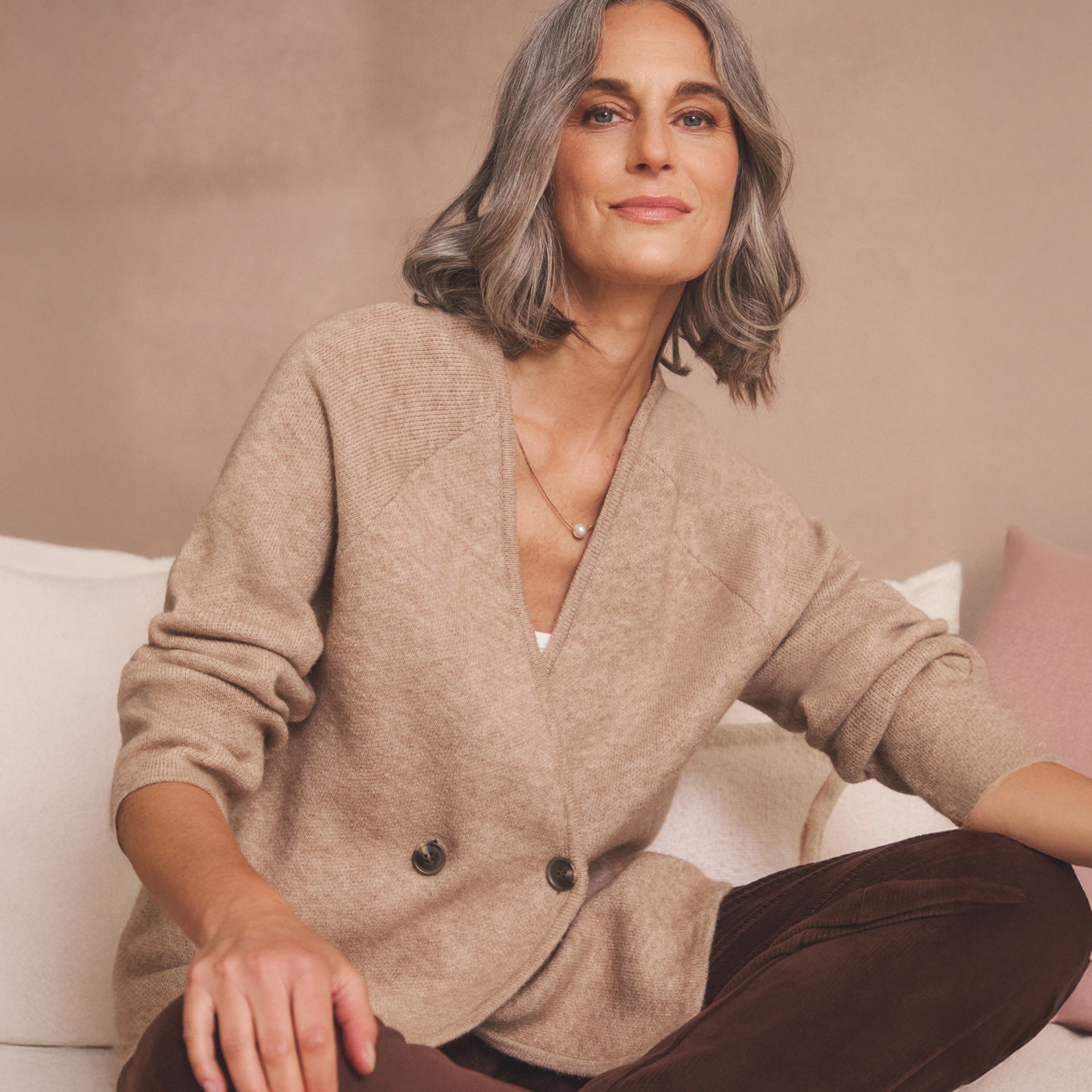 Woman in beige cardigan
