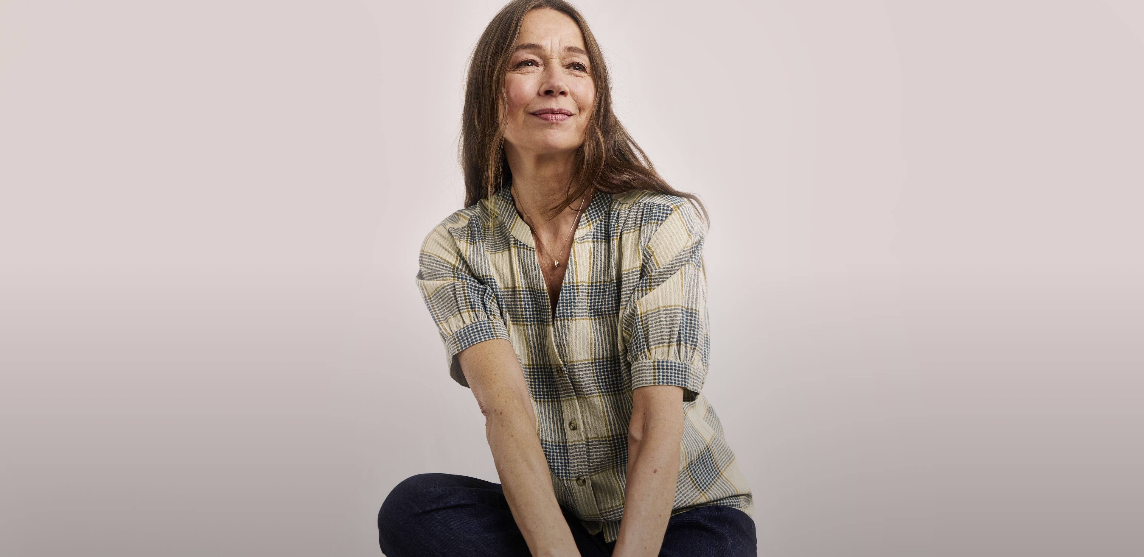 Woman wearing a Julipa check print blouse