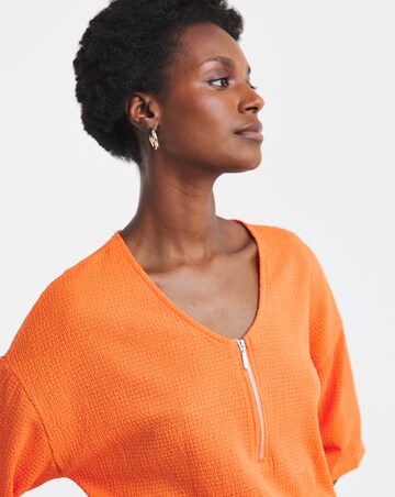 Orange Textured V-Neck Zip Front Short Sleeve Longline Top