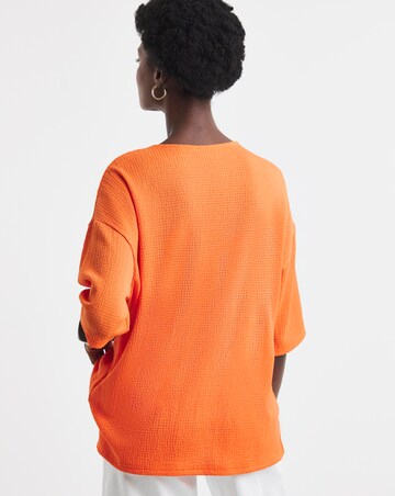 Orange Textured V-Neck Zip Front Short Sleeve Longline Top